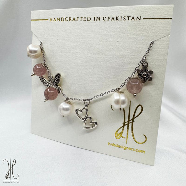 STRAWBERRY QUARTZ AND PEALRS CHARMS BRACELETS.